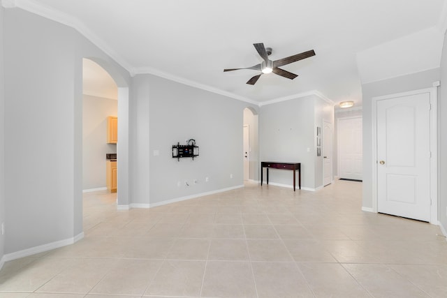 unfurnished room featuring ceiling fan, light tile patterned flooring, and ornamental molding