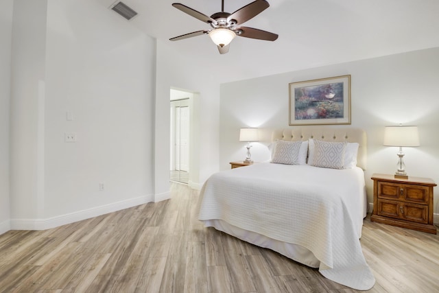 bedroom featuring ceiling fan and light hardwood / wood-style flooring