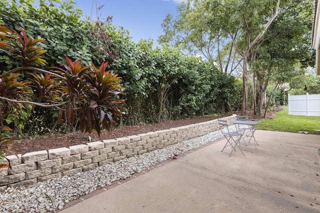 view of patio featuring fence