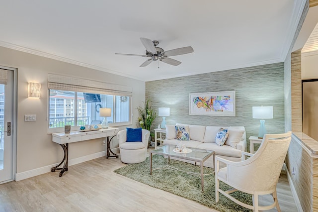 living room featuring light hardwood / wood-style flooring, ceiling fan, and ornamental molding