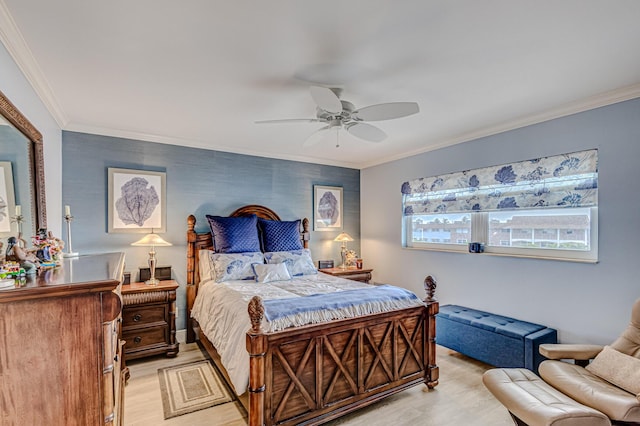 bedroom featuring light wood-type flooring, ceiling fan, and crown molding