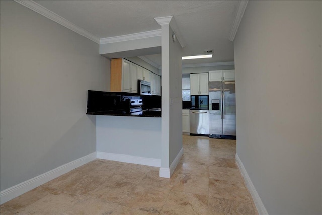 kitchen featuring white cabinets, appliances with stainless steel finishes, backsplash, and crown molding