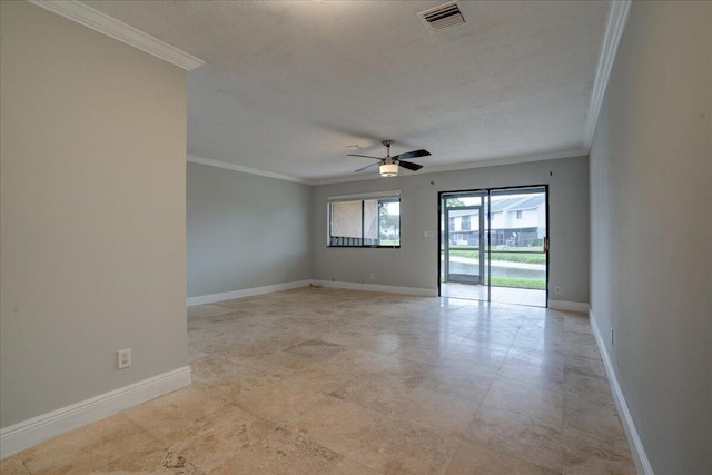 spare room with a textured ceiling, ceiling fan, and ornamental molding