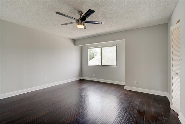 unfurnished bedroom with dark hardwood / wood-style flooring, a textured ceiling, and ceiling fan