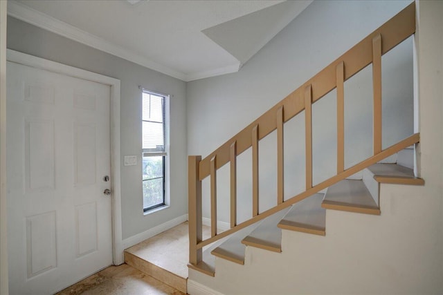 foyer featuring crown molding