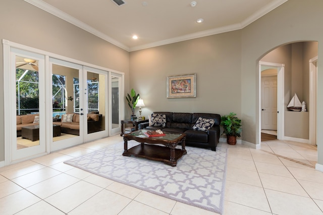 18640 SE River Ridge Rd, Jupiter, FL 33469 - tiled living area with french doors, crown molding, arched walkways, recessed lighting, and baseboards