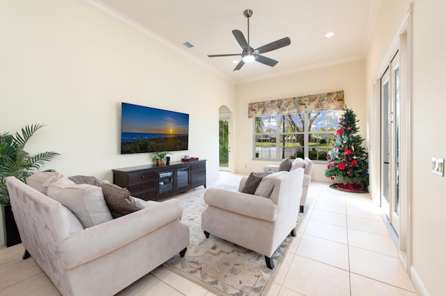 living room featuring crown molding, ceiling fan, and light tile patterned floors