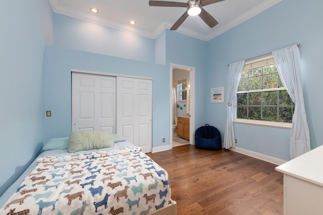 bedroom featuring ensuite bathroom, dark hardwood / wood-style floors, ceiling fan, crown molding, and a closet