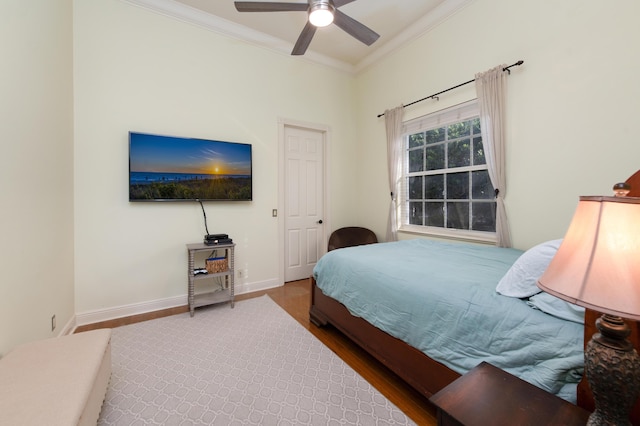 18640 SE River Ridge Rd, Jupiter, FL 33469 - bedroom featuring ornamental molding, baseboards, a ceiling fan, and wood finished floors