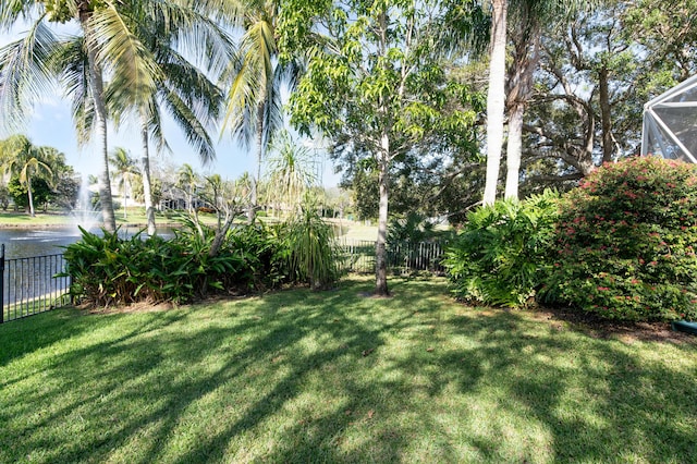 view of yard featuring glass enclosure