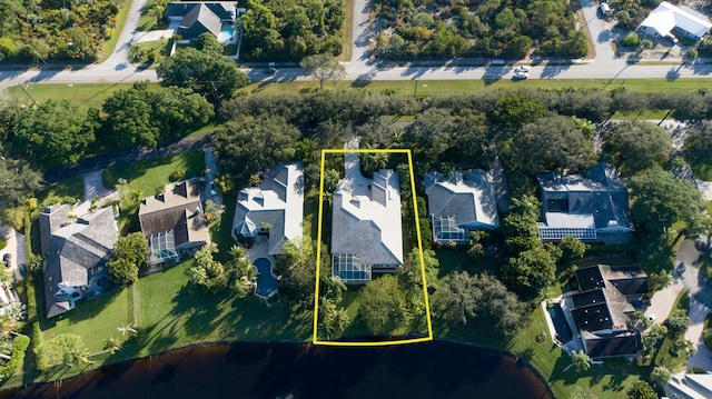 18640 SE River Ridge Rd, Jupiter, FL 33469 - aerial perspective of suburban area featuring a nearby body of water and property parcel outlined