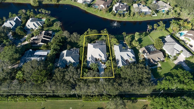 18640 SE River Ridge Rd, Jupiter, FL 33469 - aerial view of residential area featuring a large body of water and property parcel outlined