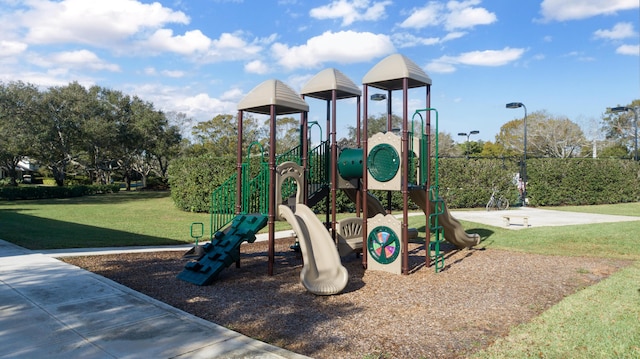 view of jungle gym with a lawn