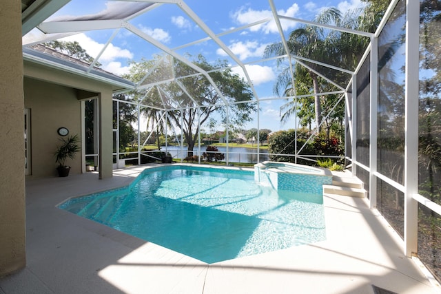 18640 SE River Ridge Rd, Jupiter, FL 33469 - view of pool featuring a patio, a water view, a pool with connected hot tub, and glass enclosure