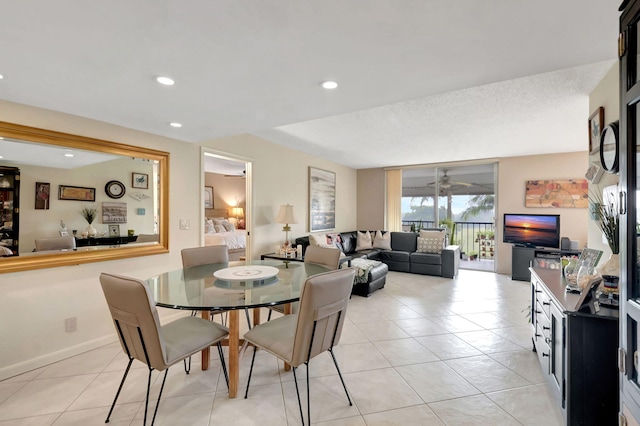 dining area featuring light tile patterned floors and ceiling fan