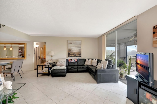 living room with light tile patterned floors and a textured ceiling