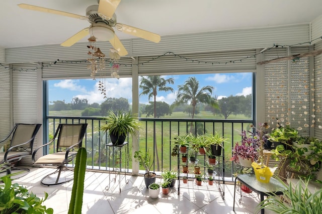 sunroom / solarium featuring ceiling fan and plenty of natural light