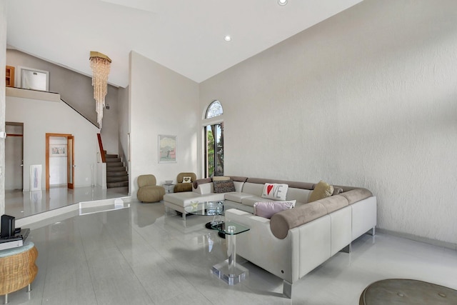 living room featuring high vaulted ceiling