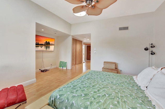 bedroom with ceiling fan and wood-type flooring