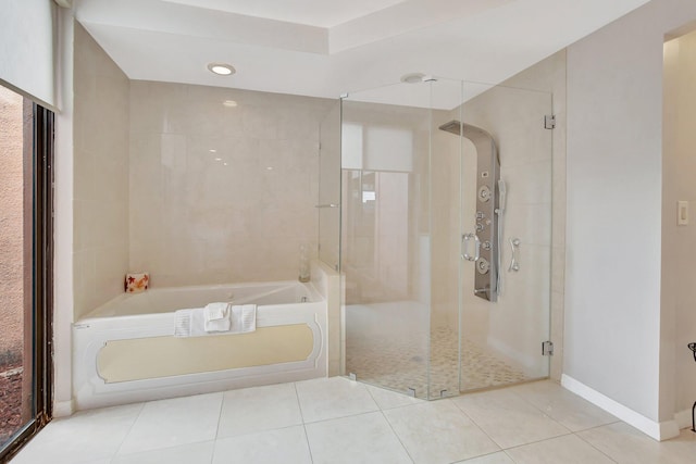 bathroom with plus walk in shower and tile patterned floors