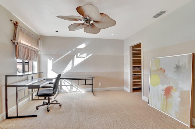 office featuring ceiling fan and light carpet