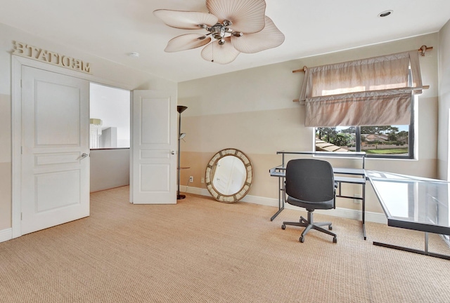 home office featuring light colored carpet and ceiling fan