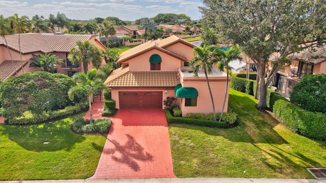 mediterranean / spanish house with a front lawn