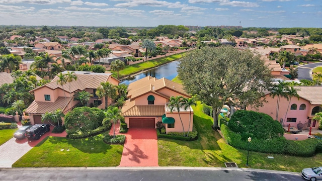 birds eye view of property with a water view