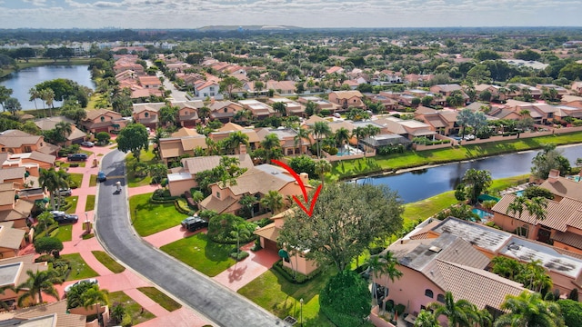 bird's eye view with a water view