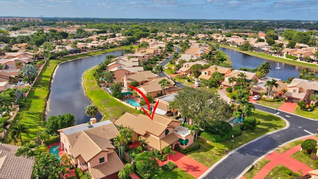 birds eye view of property featuring a water view