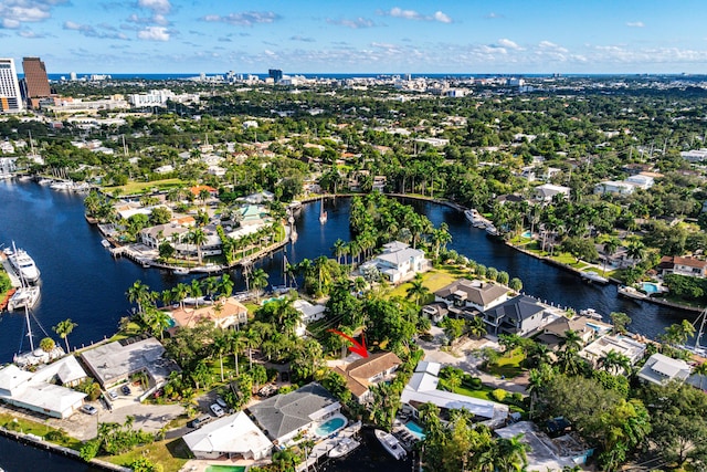 bird's eye view featuring a water view and a residential view