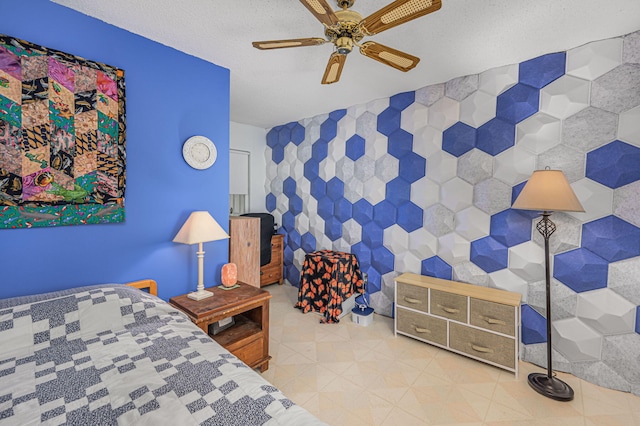 bedroom featuring a textured ceiling, ceiling fan, and tile walls