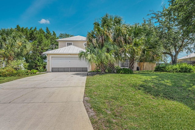 view of front facade featuring a garage and a front yard