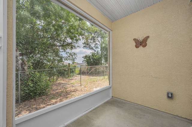 unfurnished sunroom featuring plenty of natural light