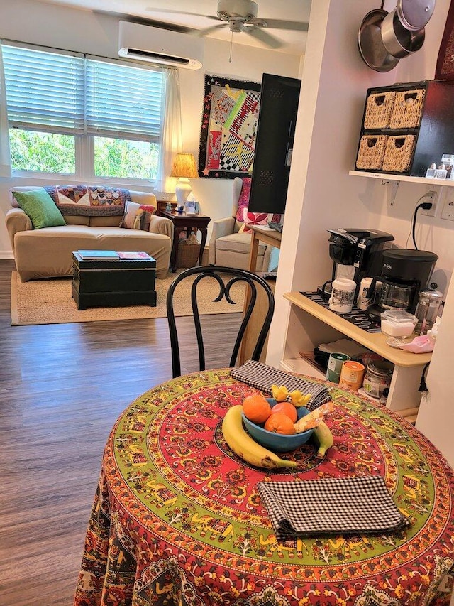 dining room with hardwood / wood-style floors, an AC wall unit, and ceiling fan