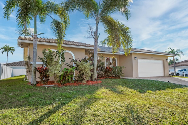 view of front facade with a front yard and a garage