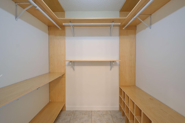 walk in closet featuring light tile patterned floors