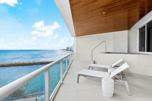 balcony featuring a water view