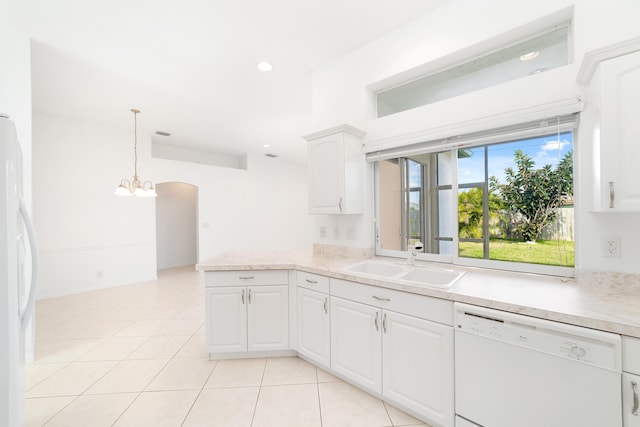 kitchen with dishwasher, sink, refrigerator, decorative light fixtures, and white cabinets