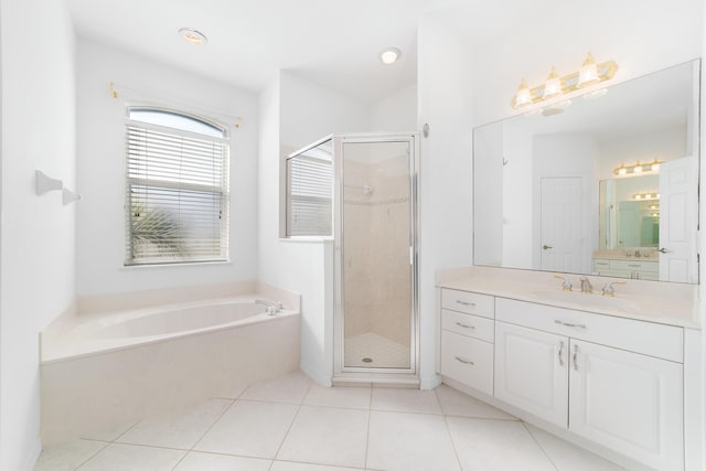 bathroom featuring separate shower and tub, tile patterned flooring, and vanity