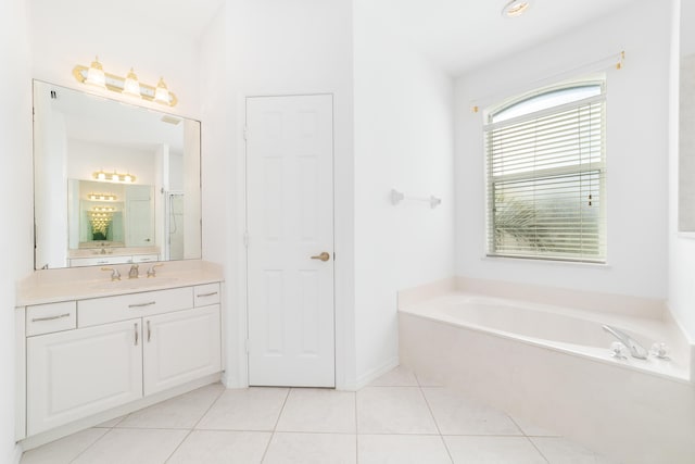 bathroom with plus walk in shower, tile patterned flooring, and vanity