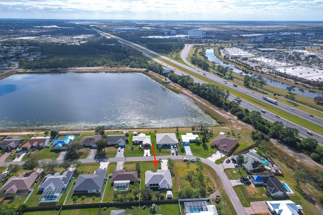 drone / aerial view with a water view