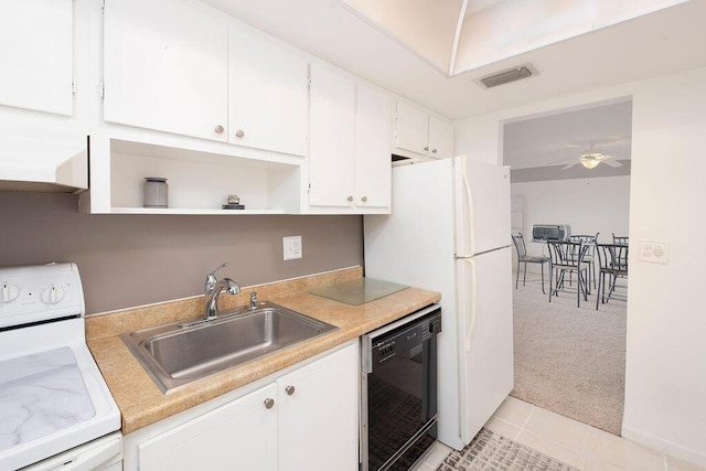 kitchen featuring dishwasher, sink, white range oven, light colored carpet, and white cabinets