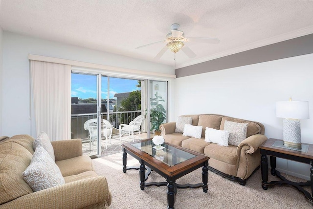 carpeted living room with ceiling fan, crown molding, and a textured ceiling