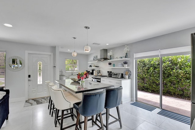 dining area with a healthy amount of sunlight and sink