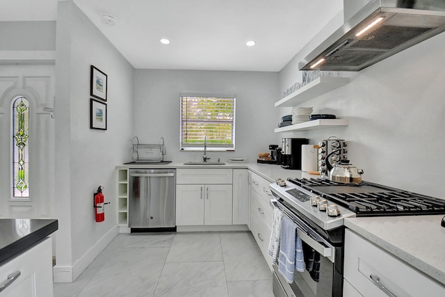 kitchen featuring sink, light stone counters, ventilation hood, stainless steel appliances, and white cabinets