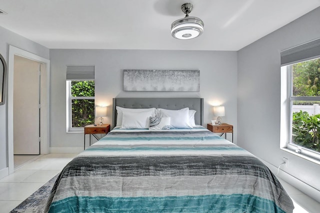 bedroom featuring light tile patterned flooring