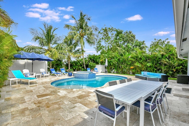 view of pool featuring an in ground hot tub, a patio, and an outdoor hangout area