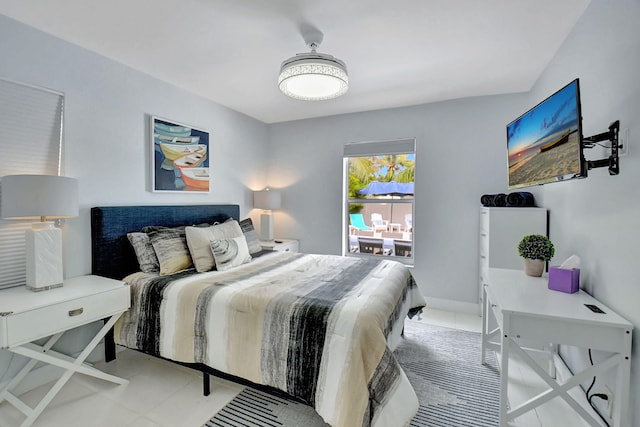 bedroom with light tile patterned floors