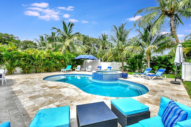 view of swimming pool with an in ground hot tub, french doors, and a patio area